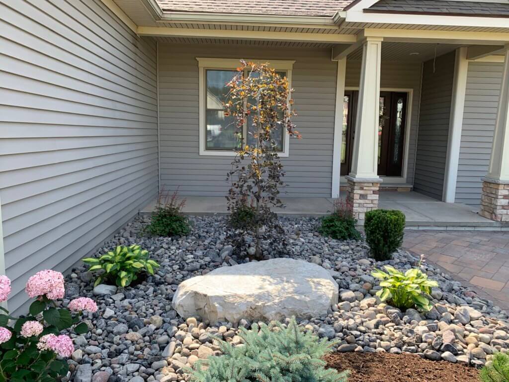 Required tree and shrub bed planting with rock